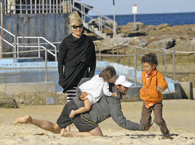 Hugh Jackman horses around with his kids, Oscar and Ava, at Bondi Beach in Sydney, Australia. by HOLLYWOOD KIDS
