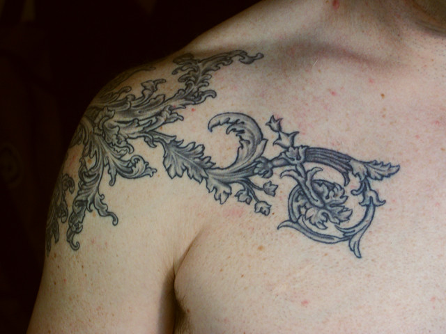 As the pattern moves onto Mark's pectoral, it becomes more Victorian, 
