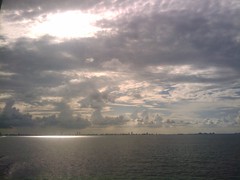 Sun Shining Through Clouds Over Miami