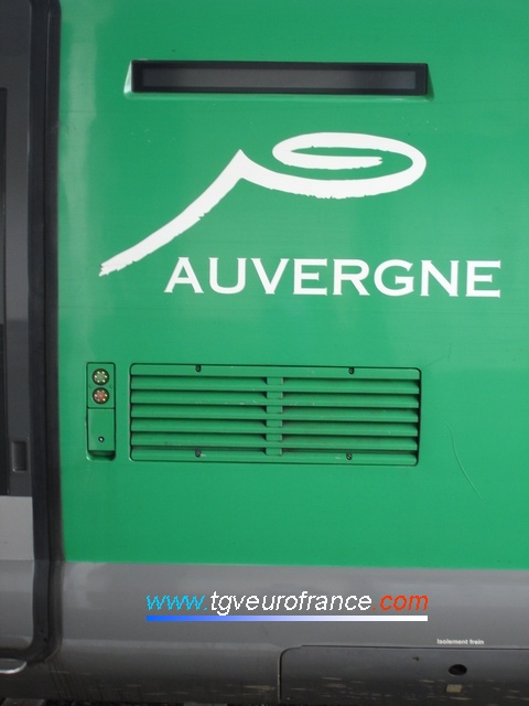 A detailed view of the logo of the Auvergne Region on an X73500 SNCF railcar