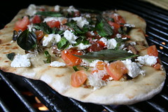 Grilled pizza with eggplant, tomatoes, goat cheese and basil