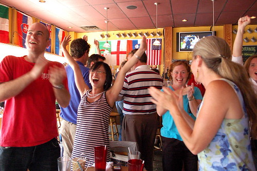 Local soccer fans celebrate the U.S. win over Algeria at the Asheville Pizza Company