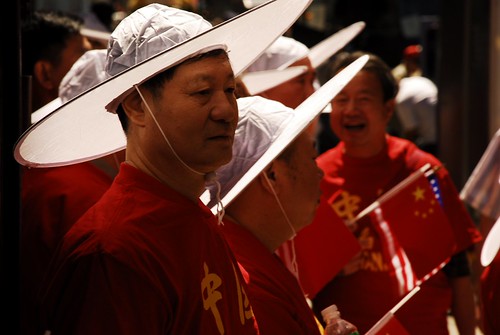 Chinese Men in the Sun Under White Hats Immigrants Parade 1