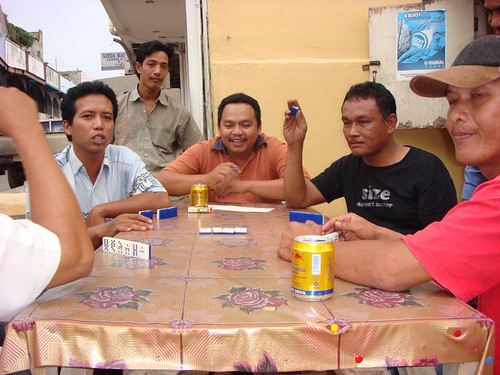 Locals playing domino. Nagoya, Batam Island, Northern Indonesia.