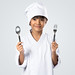 Happy little chef holding a spoon and fork