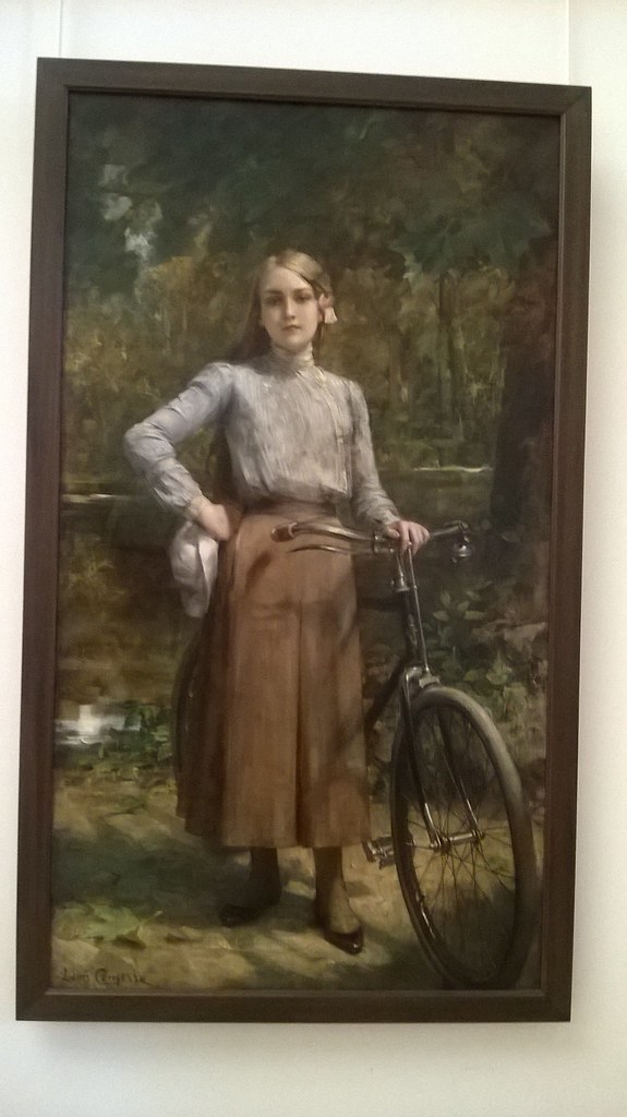: En bicyclette au V'esinet, L'eon Francois Comerre.  Painting of young woman with bicycle, 1903