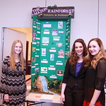 Students pose in front of their project on the Amazon Rain Forest.
