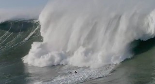 Big Wave Surfer At Nazaré Misses His Jet Ski Tow, Gets Hit Full Force By Massive Wave
