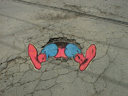 Superboy stuck in a pothole