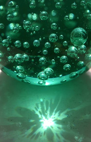 Green Glass Ball with Sun Reflection
