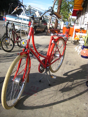 A candy red Verlobis Danneborg parked in front of Flying Pigeon LA.