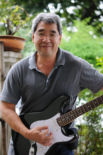 John Ishii playing the guitar. Full-sized Nikon 60mm f/2.8G AF-S Micro-Nikkor test photo. DSC_4027