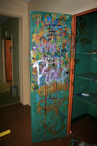 Camp House storage closet employee graffiti (left door)
