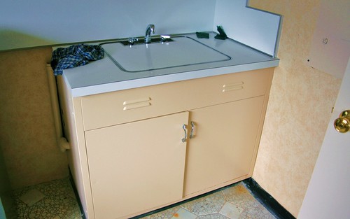 Covered sink in the washer/dryer room