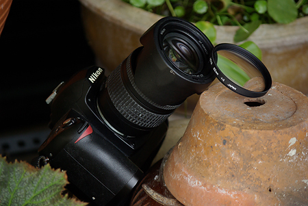 Hoya +4 next to the D70 plus Nikkor 28-200mm lens