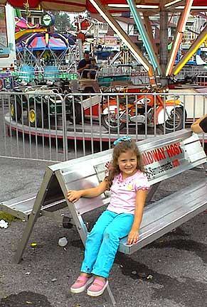 08-29-03-Rachel on bench on Midway Atown Fair