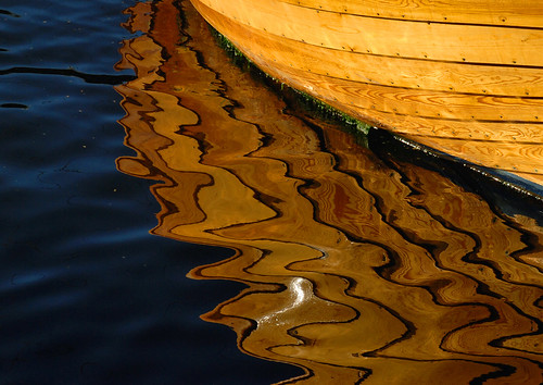 Reflection of boat in water