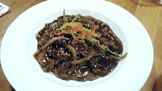 Wu Tang Beef: spicy beef with onions, blanched jamaican style chilis, and black pepper sauce