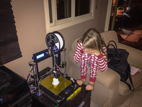 Nora watching the 3d printer do its stuff. • <a style="font-size:0.8em;" href="http://www.flickr.com/photos/96277117@N00/25005776534/" target="_blank">View on Flickr</a>