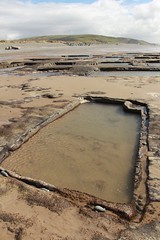 Patterns in peat, uncovered on the beach at Aberdyfi, Wales.