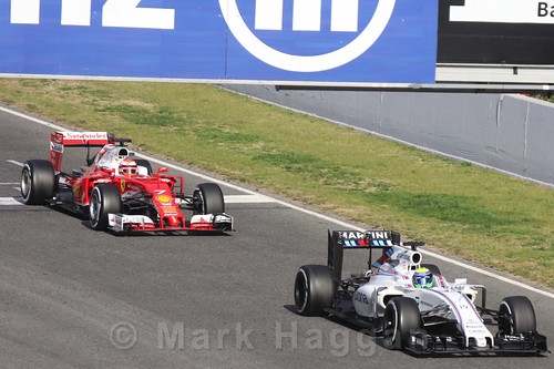 Kimi Raikkonen's Ferrari and Felipe Massa's Williams during Formula One Winter Testing 2016