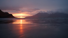Island sunset reflecting onto the beach in Scotland