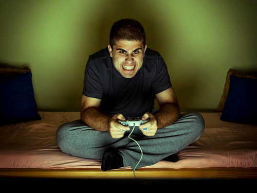 Angry young man playing video games - Credit to lyncconf.com/, From FlickrPhotos