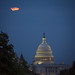 A perigee full moon or supermoon is seen behind clouds over the United States Capitol, Sunday, August 10, 2014, in Washington. Original from NASA. Digitally enhanced by rawpixel.