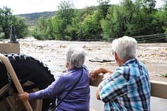 Dick and LaRue Vodime, temporary residents of Lyons, Colo., view some of the destruction caused by flooding in Boulder County, Colo.  (CONG)