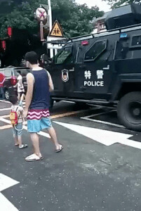 In Asia, a little boy exchanged gunfire with the police on the street.