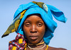 Portrait of a mucubal tribe woman with a blue headwear, Namibe Province, Virei, Angola