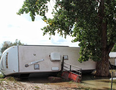 A 5th wheel RV trailer is overturned off of McKay Road south of 96th Ave on September 13, 2013. (Adams County)