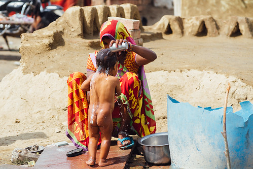 Village Woman Bathing Child, Uttar Pradesh India