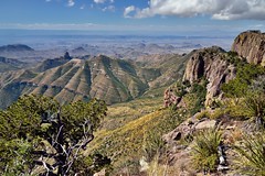Blue Skies and Clouds Above the Peaks and Mountainsides of the Chisos Mountains (Big Bend National Park)