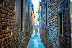 Seeing a human being on the street helps you understand just how narrow the streets in Venice Italy really are.